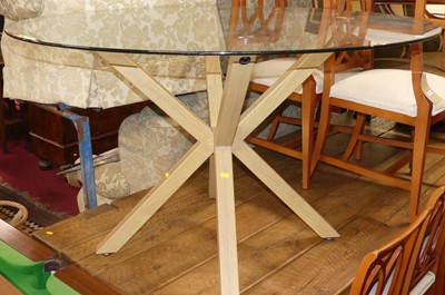 Lot 1246 - A contemporary glass topped circular breakfast...