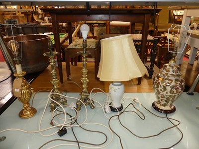 Lot 1257 - A pair of brass pedestal table lamps; together...