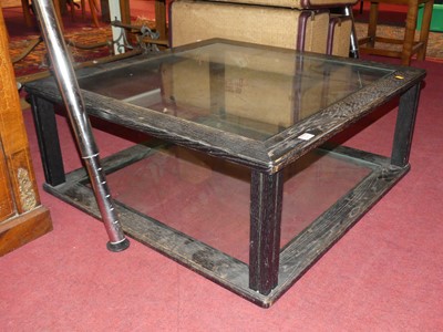 Lot 1260 - *A two-tier glass inset square low coffee...