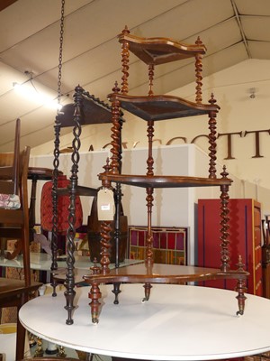 Lot 1263 - A mid-Victorian rosewood four-tier serpentine...