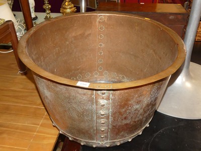 Lot 1266 - An early 20th century riveted copper circular...