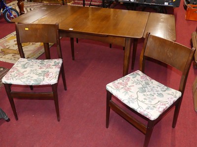Lot 1269 - A 1960s teak dining suite, comprising a...