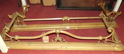 Lot 1273 - Two late Victorian brass fire fenders