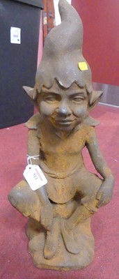 Lot 511 - A rusted cast iron model of a pixie, h.47cm