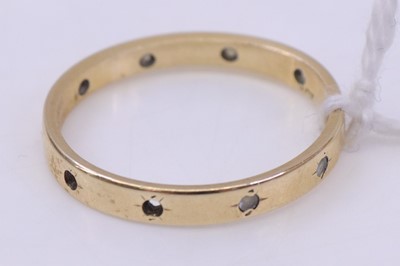 Lot 352 - A 9ct gold white paste set eternity ring (some...