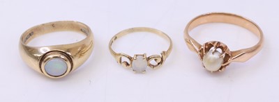 Lot 355 - Three yellow metal dress rings, two set with...
