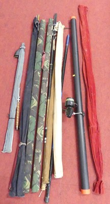 Lot 534 - A collection of fishing rods to include a...