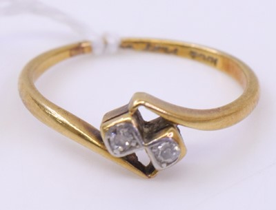 Lot 368 - An 18ct gold diamond crossover ring, illusion...