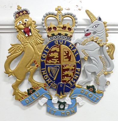 Lot 525 - A reproduction painted metal Royal Coat of...