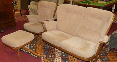 Lot 1280 - An Ercol mid-elm stickback three-piece lounge...