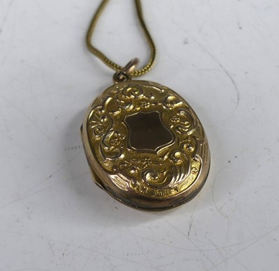 Lot 397 - A Victorian gilt metal double-sided photograph...