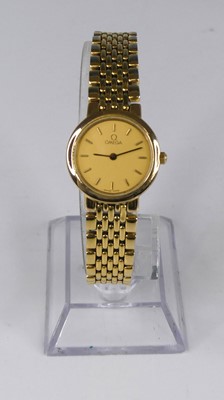 Lot 422 - A lady's Omega gold plated bracelet watch,...