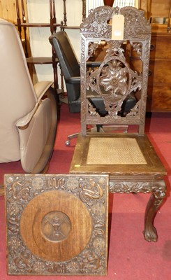 Lot 1291 - An Indian relief carved hardwood rush seat...