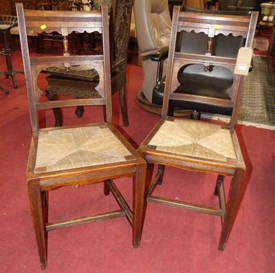 Lot 1294 - A pair of Victorian walnut rush seated dining...