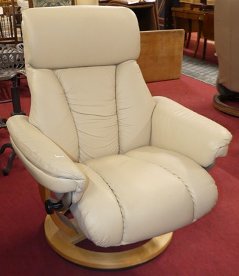Lot 1297 - A contemporary pale cream leather upholstered...