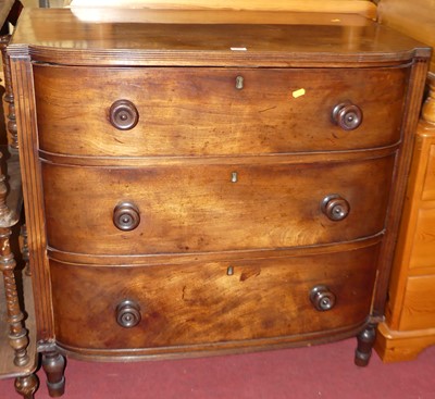 Lot 1304 - A Regency mahogany bowfront chest of three...
