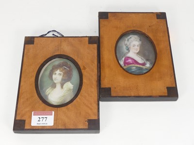 Lot 277 - A pair of reproduction oval portrait...
