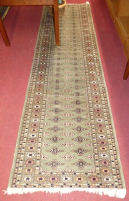 Lot 1328 - A Persian woollen sage green ground Bokhara...