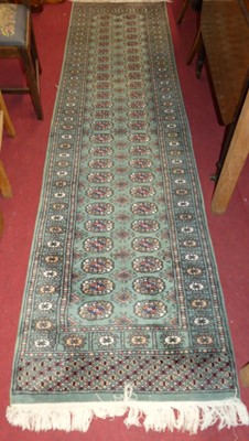 Lot 1330 - A Persian woollen jade green ground Bokhara...