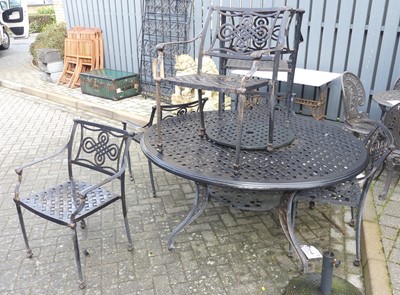 Lot 1352 - A black painted wrought metal patio suite,...