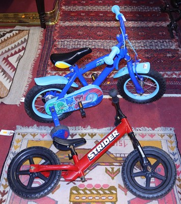 Lot 597 - A childrens bike by PJ masks and a push bike...