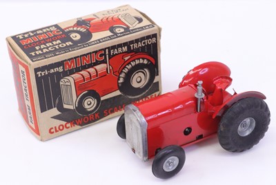 Lot 1789 - Triang Minic clockwork tractor in red body,...